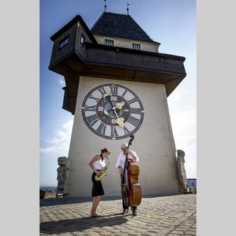 Uhrturm mit Musikern, Graz, Schlossberg | © STG | Tom Lamm