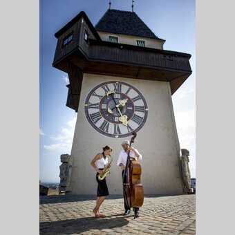 Uhrturm mit Musikern, Graz, Schlossberg | © STG | Tom Lamm