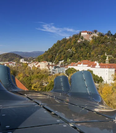 Graz with Kunsthaus and Schlossberg together with Clock Tower and Mariahilfer Church | © Steiermark Tourismus | Harry Schiffer