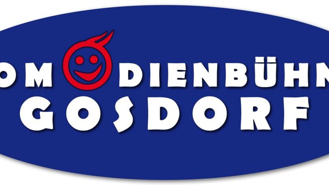 Ein ovales Logo mit einem blauen Hintergrund. Darauf steht "Komödienschbühne Gosdorf" in großen weißen Buchstaben und ein rotes Smiley-Symbol. | © Komödienbühne Gosdorf