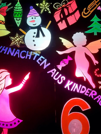 Colorful Christmas decoration featuring a snowman, gifts, and festive symbols. The text "Christmas from a child's eyes" is presented in bright colors.