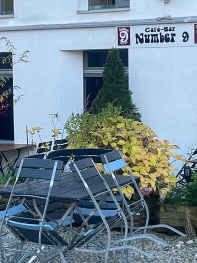 An elegant wine glass stands in a recess made of wood. The warm wood texture creates a beautiful contrast to the clear glass. | © TVB Ausseerland- Salzkammergut_Nathalie Schröttenhamer