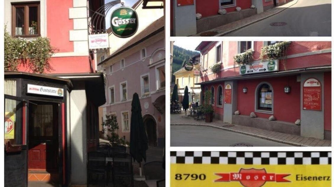 Eine malerische Straße mit einem Restaurant und einem Taxi-Schild. Die Gebäude sind farbenfroh gestaltet und die Umgebung ist ruhig. | © Gaststätte Franz August