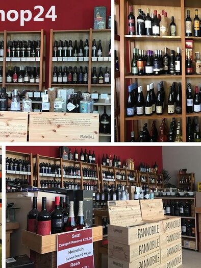 A wine shop with a variety of wine shelves and a friendly seller. The shelves are well stocked with different wines and drinks. | © Weinshop 24