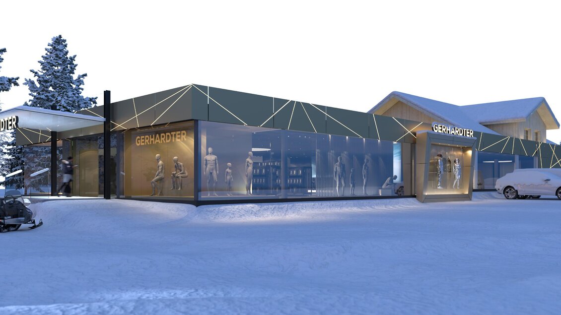 Ein modernes Gebäude in einem verschneiten Umfeld. Die große Glasscheibe lässt viel Licht hinein und bietet einen Blick auf die Inneneinrichtung. | © Intersport Gerhardter